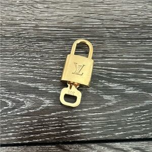 Louis Vuitton Elegant Gold Padlock with Key